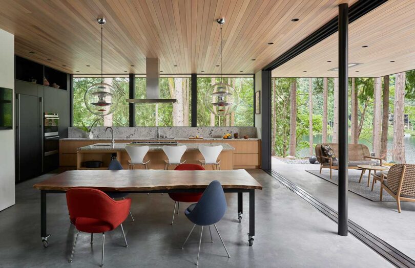 interior of modern home with dining room and kitchen with wood deiling