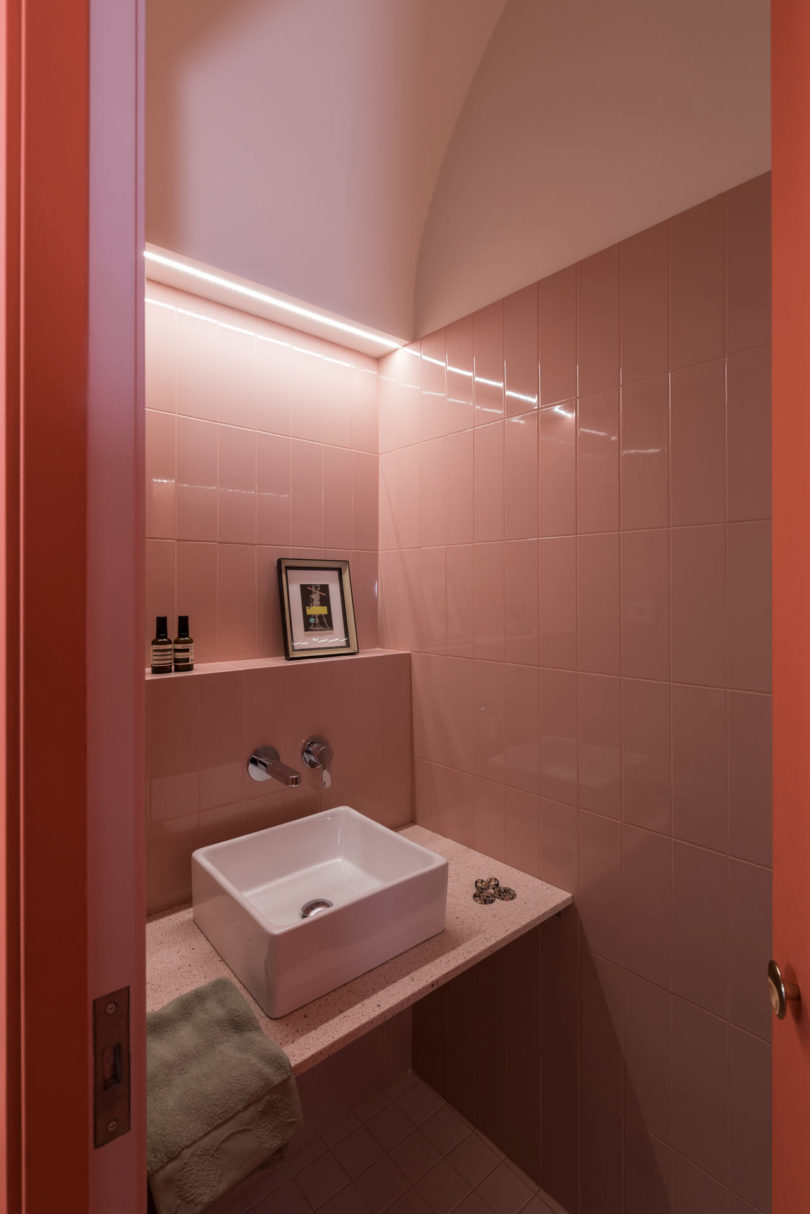 angled view of modern pink tiled bathroom