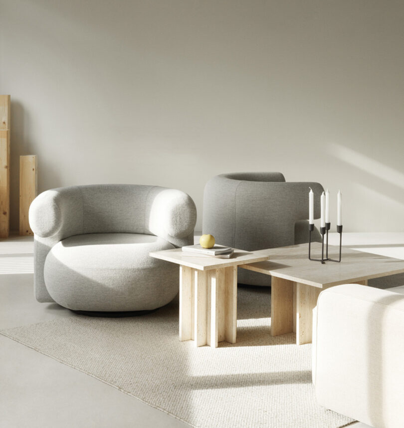 two lounge chairs with a coffee table in a styled space