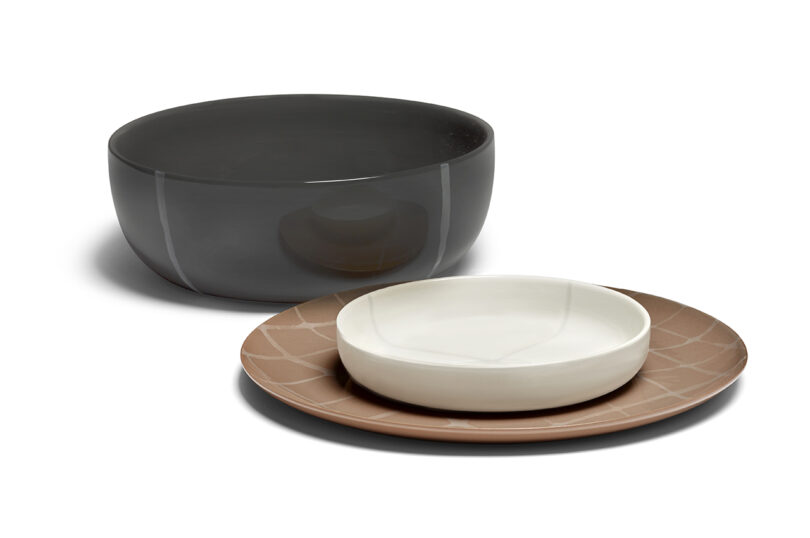 white, black, and terracotta tableware on a white background