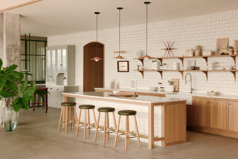 long kitchen island with four stools 