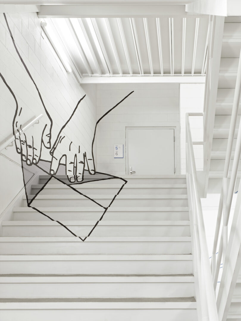 perspective art in white stairwell