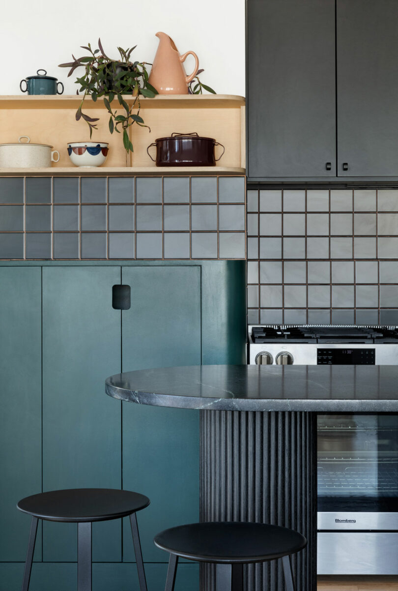 Kitchen island, cabinet, and backsplash details.