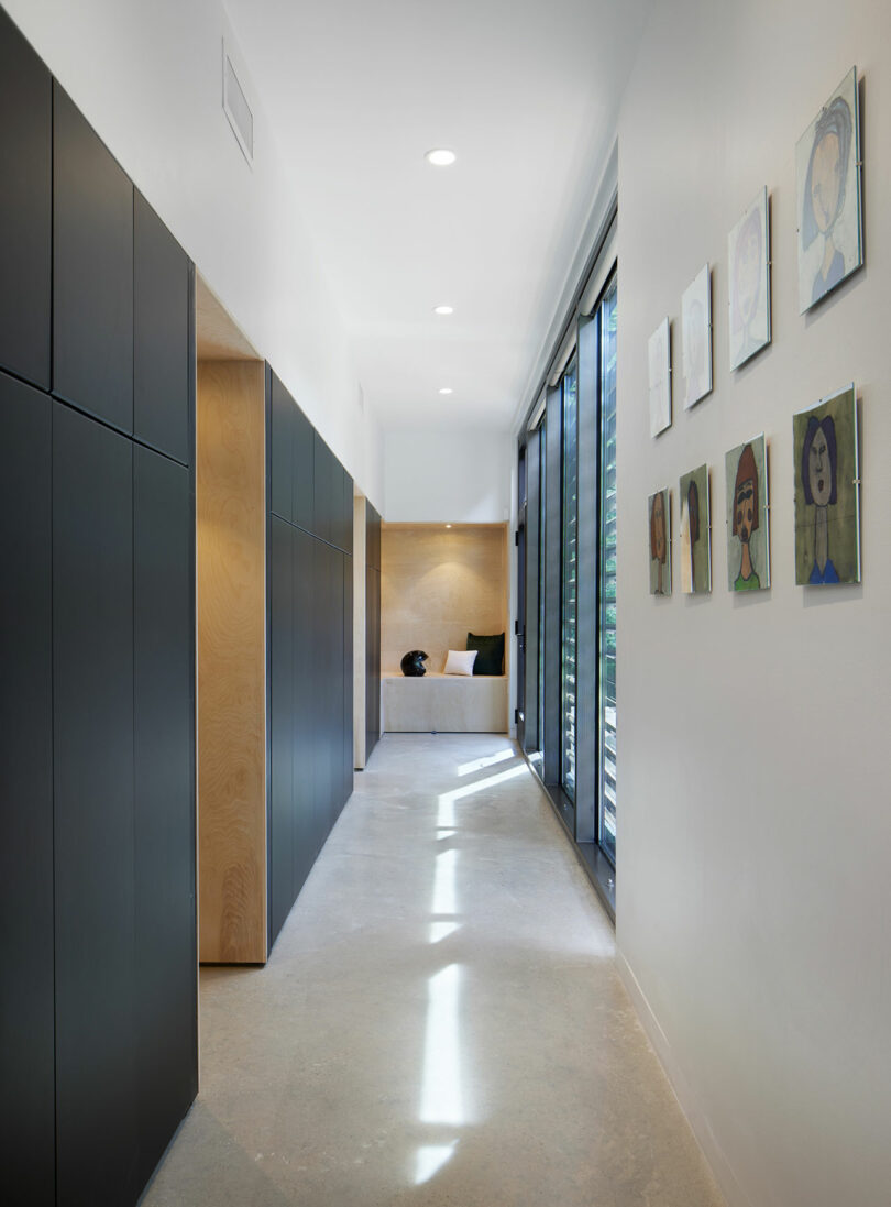 A hallway with a black accent wall.