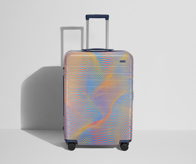 A colorful, patterned AWAY x Resident Advisor Soundwave upright rolling luggage with an extended handle.