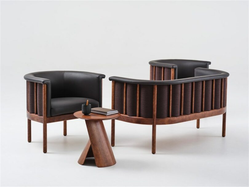 wooden coffee table next to two leather sofas