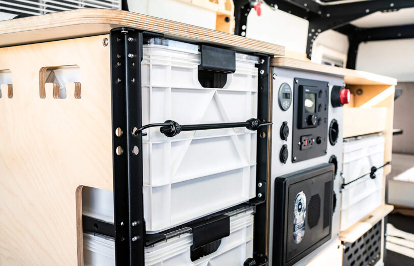 Interior view of a modern Dark Sky Mantis adventure trailer showcasing storage solutions and built-in amenities.