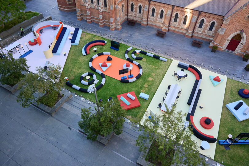 Outdoor lounge area with oversized, circular, black and white sofas