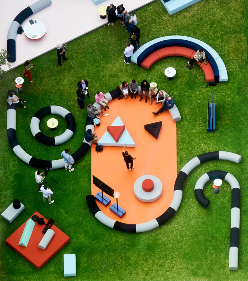 Outdoor lounge area with oversized, circular, black and white sofas