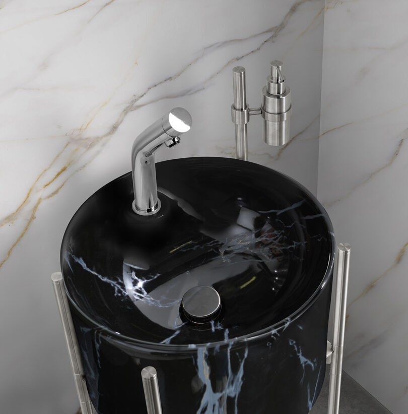detail of black faux marble cylindrical sink console